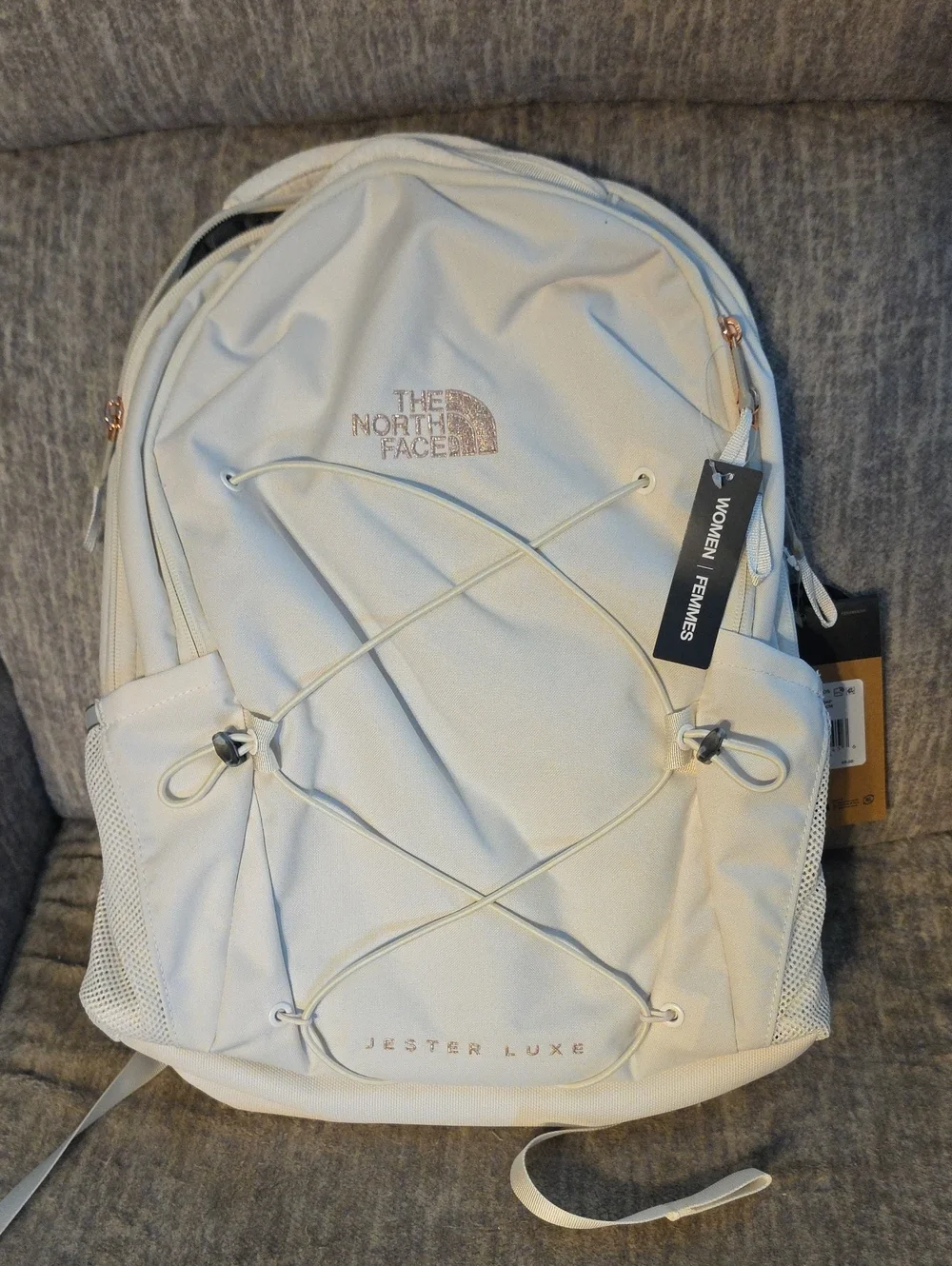 The North Face Jester Luxe Backpack - Cream/Light Beige with Rose Gold Accents.